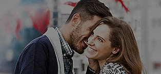 man whispering into a womans ear