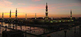 An Islamic Mosque (in Medina, Saudi Arabia) at night.  Mosque is called Masjid An-Nabawi(Mosque of the Prophet)