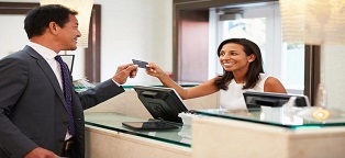 Businessman checking into hotel