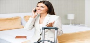 woman on phone in hotel room