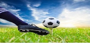 foot kicking a soccer ball