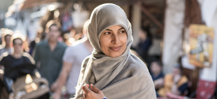 muslim woman with head scarf in outdoor market