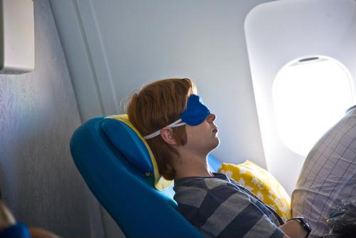 person sleeping on plane